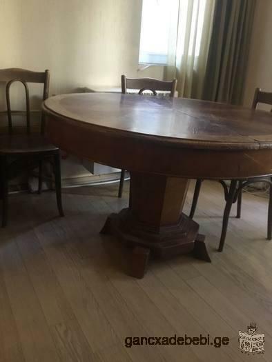 For sale, a massive wooden round table.